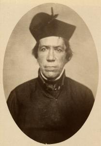 Vignette photograph of George Fenwick, wearing black robes and a Jesuit biretta