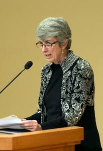 Peggy Fry speaks at a podium