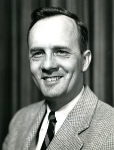 Peter Laux wearing a plaid sportscoat and tie