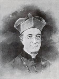 James Van de Velde, an older man with glasses wearing a Jesuit biretta, dark robes, and white collar
