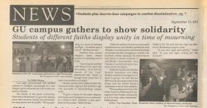 Newspaper article which includes two photographs of vigil participants.