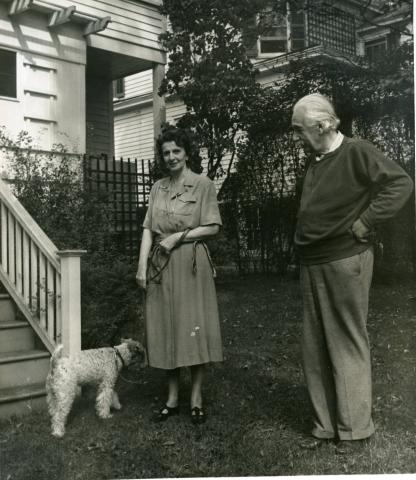 Albert Einstein with his wife and dog.
