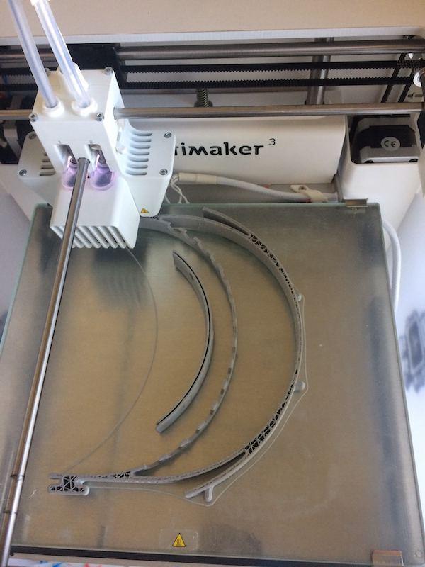 The Ultimaker 3D printer in action, printing face shield frames