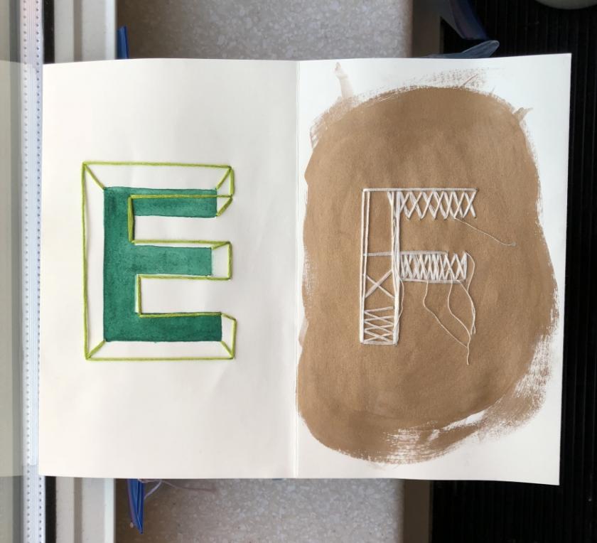 Embroidered letters "E" and "F"
