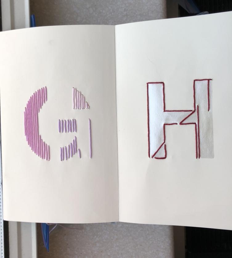 Embroidered letters "G" and "H"