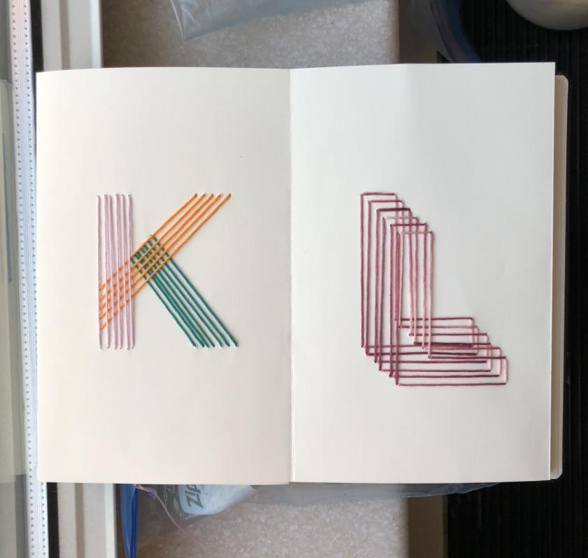 Embroidered letters "K" and "L"