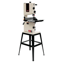 a white bandsaw sits on a black steel frame