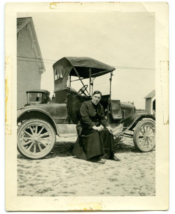 John LaFarge, S.J., in front of a car in Southern Maryland