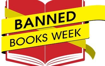 A red book with yellow tape across it that says "Banned Books Week"