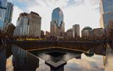 The September 11th memorial with the Manhattan skyline in the background