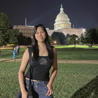 woman standing in front of the capital building