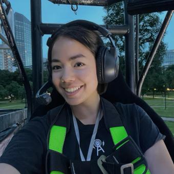 woman wearing a headset while operating machinery