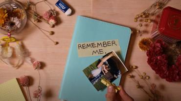 Journal cover with the words "Remember Me" written on it. 