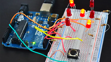 an arduino connected to a breadboard with LEDs and resistors