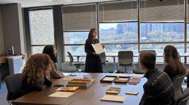 Anjelika Deogirikar Grossman discusses an artist book in the Murray Room of Lauinger Library
