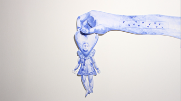 A paper cut out of a blue arm holds a paper cut out of a person wearing a dress with a heart for a head