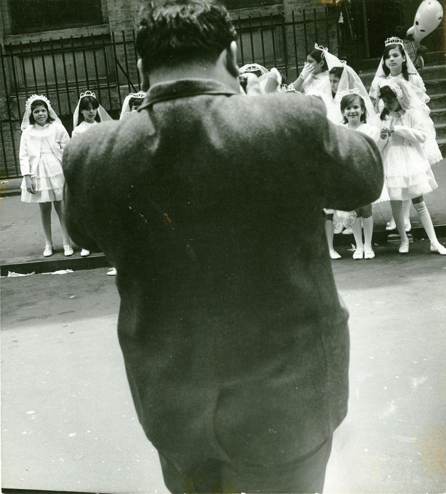 Man photographing girls on first holy communion