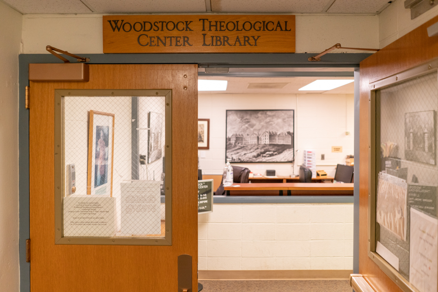Entrance to Woodstock Library, one door open, sign above the door