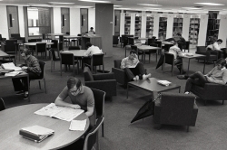 Students study at tables in the newly opened periodical reading area on the second floor of Lauinger, circa 1970