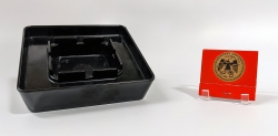 A square black bakelite ashtray, similar to the ones used in the Library in th e1970s, and a matchbook bearing the 175th Anniversary logo of Georgetown University